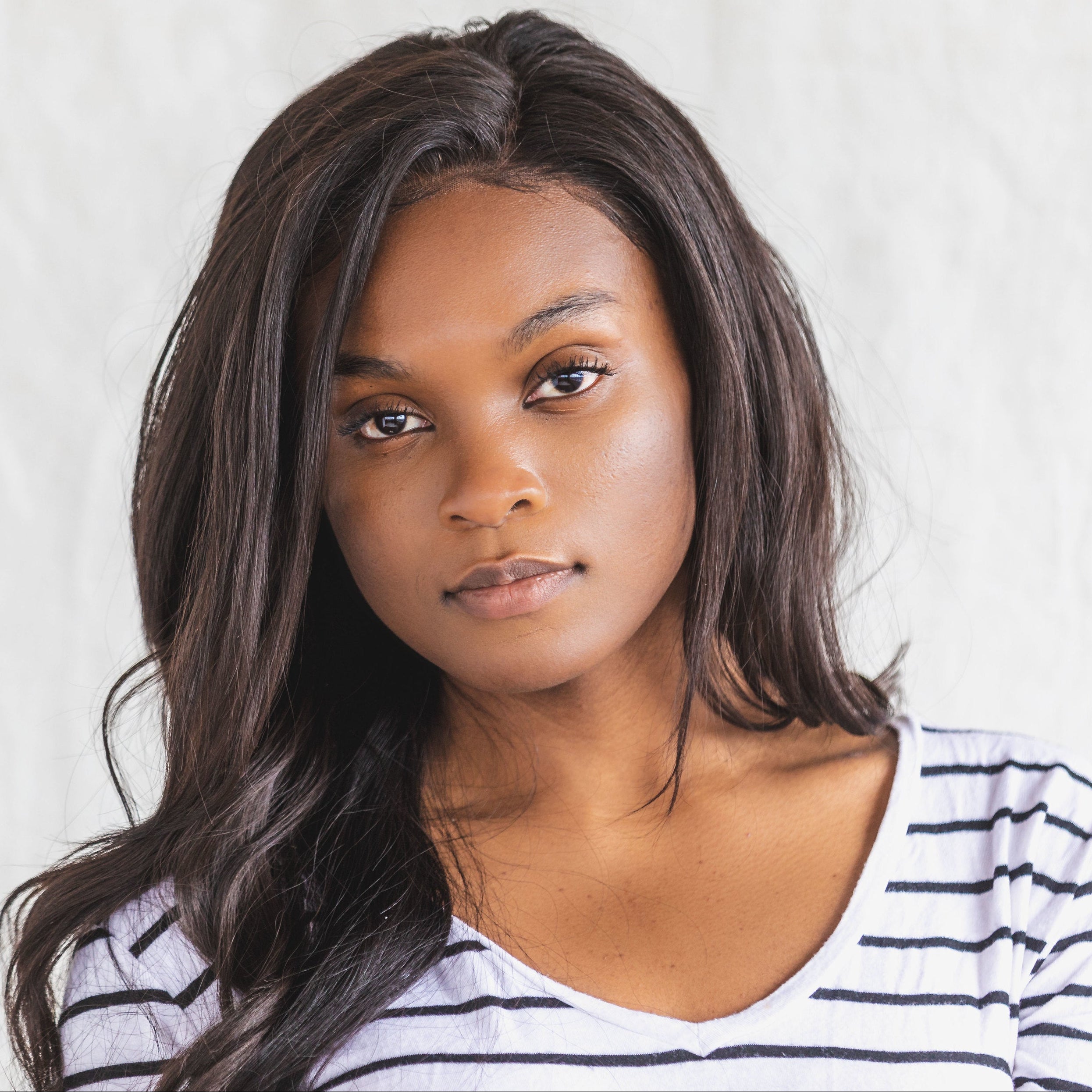 files/a-young-woman-posing-in-a-black-and-white-shirt.jpg